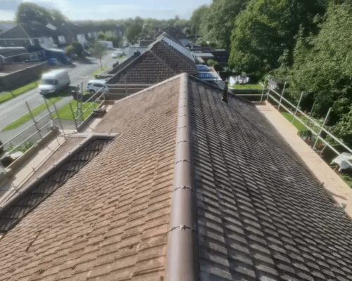 a photo showing a completed roofing project