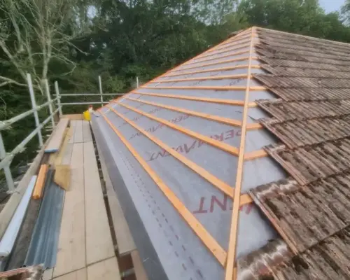 a photo showing the progress of a reroofing project
